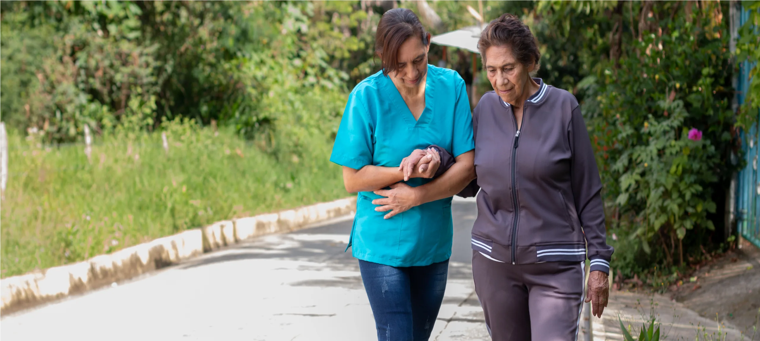 nurse-assisting-an-elderly-woman-with-walking-diff-2023-01-25-11-24-54-utc (1)