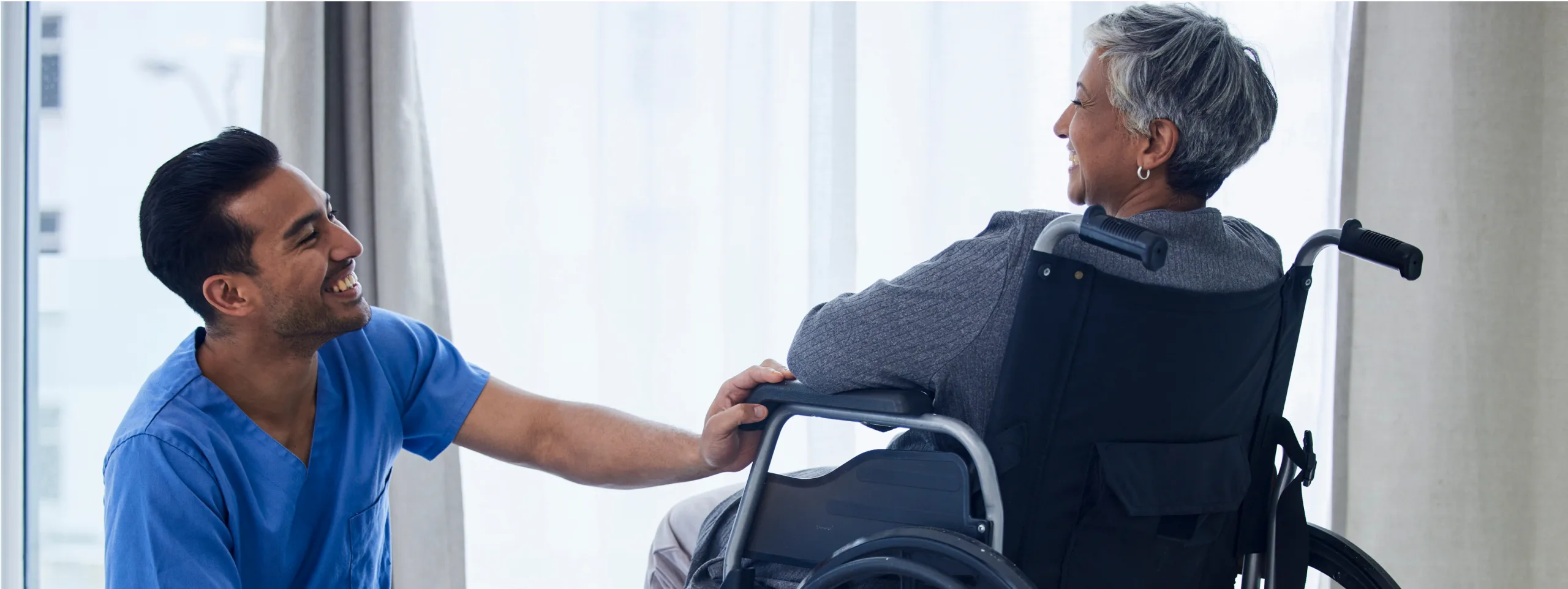 nurse-wheelchair-and-happy-woman-with-support-he-2023-07-14-08-22-28-utc